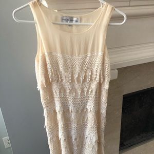 Small cream dress with intricate laced pattern